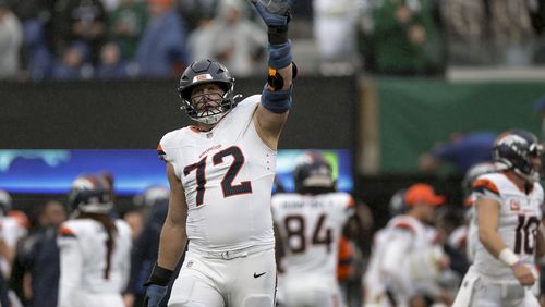 Denver Broncos offensive tackle Garett Bolles (72) reacts after defeating the New York Jets in an NFL football game, Sunday, Sept. 29, 2024, in East Rutherford, N.J. (AP Photo/Adam Hunger)