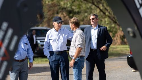 President Joe Biden greets farmer Buck Paulk (center) at his pecan farm in Ray City on Thursday, October 3, 2024, as the president surveys damage from Hurricane Helene. (Arvin Temkar / AJC)
