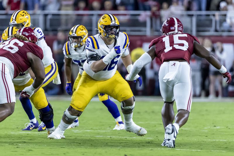 FILE - LSU offensive lineman Will Campbell (66) faces off against Alabama linebacker Dallas Turner (15) during the first half of an NCAA college football game, Saturday, Nov. 4, 2023, in Tuscaloosa, Ala. (AP Photo/Vasha Hunt, File)