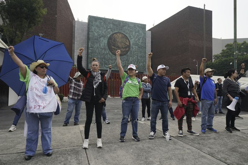 Judicial workers block entrances of Congress to protest constitutional reform proposals that would make judges stand for election in Mexico City, Tuesday, Sept. 3, 2024. (AP Photo/Felix Marquez)