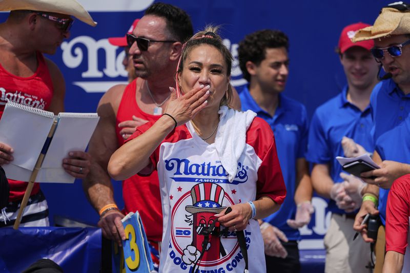 Miki Sudo reacts after winning the women's of the Nathan's Famous Fourth of July hot dog eating contest, Thursday, July 4, 2024, at Coney Island in the Brooklyn borough of New York. (AP Photo/Julia Nikhinson)