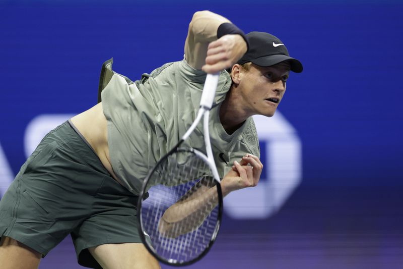 Jannik Sinner, of Italy, returns a shot to Tommy Paul, of the United States, during a fourth round match of the U.S. Open tennis championships, Monday, Sept. 2, 2024, in New York. (AP Photo/Adam Hunger)