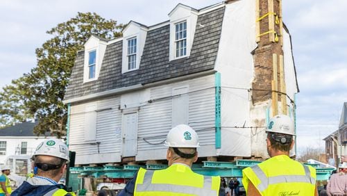 Director of Architectural Preservation Matthew Webster, Colonial Williamsburg Foundation President and CEO Cliff Fleet, Architectural Preservation Supervisor Steve Chabra stand in front of Bray School at William and Mary site.