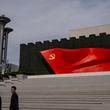 FILE - Visitors pass the Chinese Communist Party flag at the museum of the Communist Party of China in Beijing, Oct. 19, 2023. (AP Photo/Louise Delmotte, File)