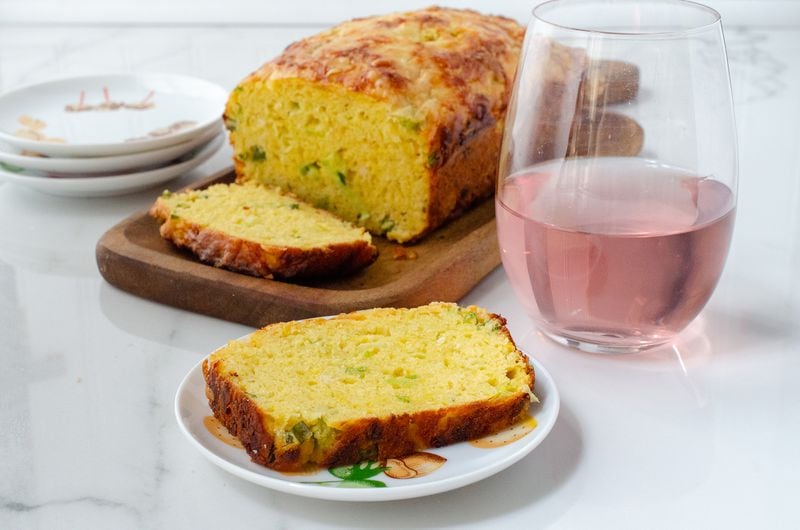 A popular cocktail appetizer in France, this Savory Yogurt Loaf is shown paired with rose wine. (Virginia Willis for The Atlanta Journal-Constitution)