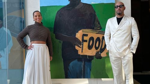 Alicia Keys and Swizz Beats with Henry Taylor's "Cornerstone." Photo by Cole Cook