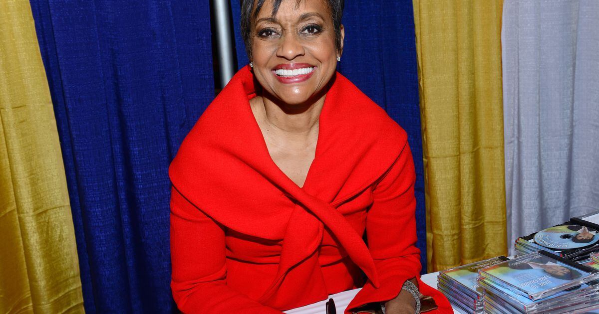 Judge Hatchett wearing a purple gown.