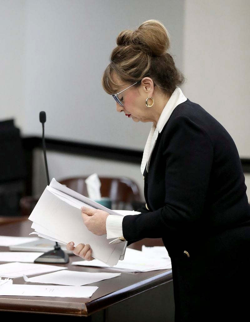 Attorney Lori Laird, representing Antonios Pagourtzis and Rose Marie Kosmetatos, parents of accused Santa Fe High School shooter Dimitrios Pagourtzis, looks through documents before closing arguments begin Friday, Aug. 16, 2024, in Galveston County Court No. 3 Judge Jack Ewing's courtroom at the Galveston County Courthouse in Galveston, Texas. (Jennifer Reynolds/The Galveston County Daily News via AP, Pool)