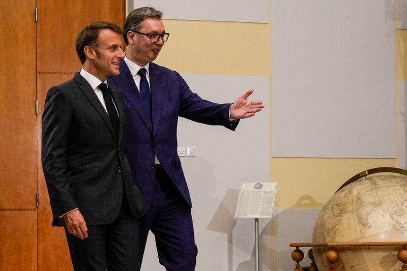 French President Emmanuel Macron walks with Serbian President Aleksandar Vucic at the start of their meeting in Belgrade, Serbia, Thursday, Aug. 29, 2024. French President Emmanuel Macron starts a two-day state visit to Serbia with the focus on a possible sale of 12 Rafale multi-purpose fighter jets to a country that has maintained close ties to Russia despite its aggression on Ukraine. (AP Photo/Darko Vojinovic)