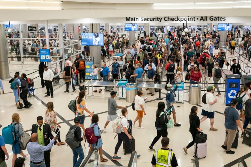 Travelers wait in long lines Monday morning at Hartsfield-Jackson International Airport following July 4th weekend. Monday, July 8th, 2024 (Ben Hendren for the Atlanta Journal-Constitution)