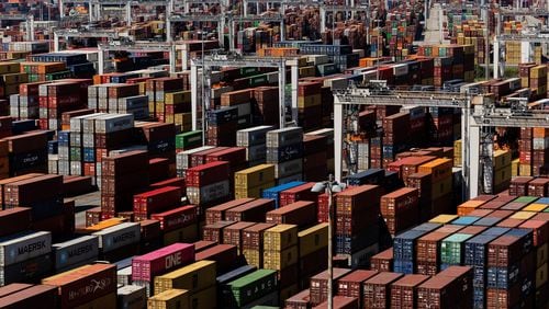 Shipping containers at the Port of Savannah, which has been running out of places to put a pileup of nearly 80,000 of them. The White House announced Tuesday that money from the infrastructure bill will help set up in-door yards to take many of those containers and alleviate the crush . (Erin Schaff/The New York Times)