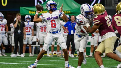 Kaeden Gilstrap, quarterback for Walton, makes a pass during the Corky Kell Classic at Mercedes Benz Stadium in Atlanta, GA on August 17, 2024. (Jamie Spaar for the Atlanta Journal Constitution)