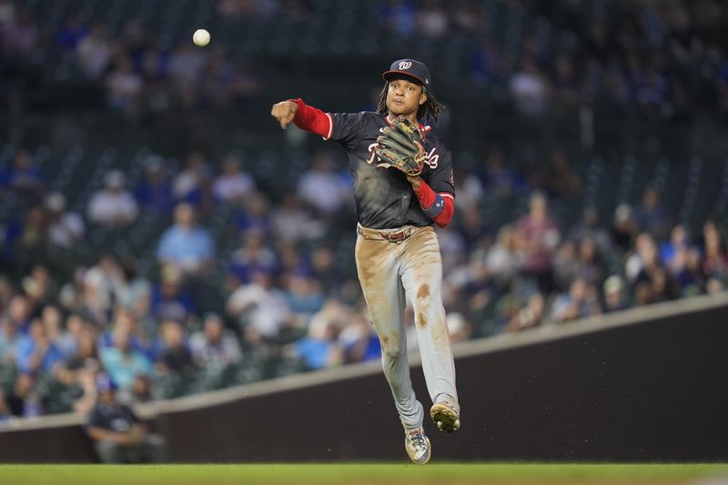 Washington Nationals shortstop CJ Abrams throws to first baseman Juan Yepez to force out Chicago Cubs' Ian Happ during the first inning of a baseball game Thursday, Sept. 19, 2024, in Chicago. (AP Photo/Erin Hooley)