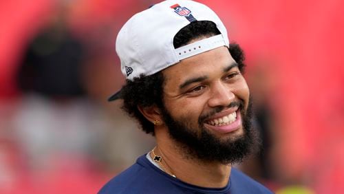 Chicago Bears quarterback Caleb Williams warms up before the start of an NFL preseason football game against the Kansas City Chiefs Thursday, Aug. 22, 2024, in Kansas City, Mo. (AP Photo/Ed Zurga)