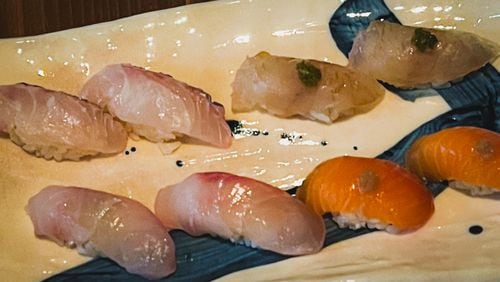 Cuddlefish features a selection of nigiri: (clockwise from top left) sea bream, hirame, kanpachi and steelhead trout. Henri Hollis/henri.hollis@ajc.com