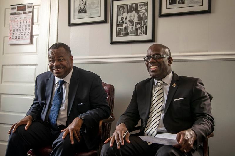 Brothers Darrell Watkins, left, and Sylvania Watkins, right, share a laugh while speaking about the hard work they put in at the start of their family's mortuary business at the Willie A. Watkins Funeral Home in Atlanta's West End community, Tuesday, July 21, 2020. (ALYSSA POINTER / ALYSSA.POINTER@AJC.COM)