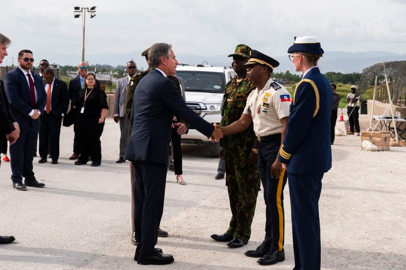 US Secretary of State Antony Blinken, left, greets the Haitian National Police General Director Rameau Normal upon arriving at the MSS base for a meeting in Port Au Prince, Haiti, Thursday, Sept. 5, 2024. (Roberto Schmidt/Pool photo via AP)