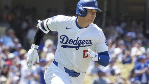 Los Angeles Dodgers designated hitter Shohei Ohtani (17) runs to first on a double during the fourth inning of a baseball game against the San Francisco Giantscin Los Angeles, Calif., Thursday, July 25, 2024. (AP Photo/Eric Thayer)