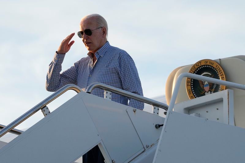 President Joe Biden salutes as he boards Air Force One at Dover Air Force Base, Del., Thursday, June 20, 2024. Biden spent a few days at his beach home in Rehoboth Beach, Del., before heading to Camp David to prepare for the upcoming presidential debate. (AP Photo/Susan Walsh)