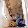 FILE - A health worker attends to a mpox patient, at a treatment centre in Munigi, eastern Congo, Monday, Aug. 19, 2024. (AP Photo/Moses Sawasawa, File)