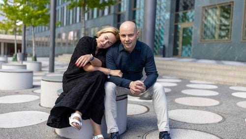 Andrei Pivovarov, a Russian dissident freed in the Aug. 1 East-West prisoner swap, right, and his wife, Tatyana Usmanova, pose for a photo before an interview with The Associated Press in Berlin, Germany, on Sunday, Aug. 12, 2024. (AP Photo/Axel Schmidt)