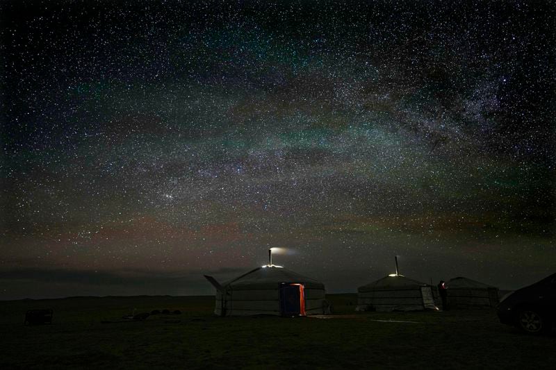 FILE- Stars light up the night sky over a ger, a portable, round tent insulated with sheepskin, in the remote Munkh-Khaan region of the Sukhbaatar district, in southeast Mongolia, Tuesday, May 16, 2023. (AP Photo/Manish Swarup, File)