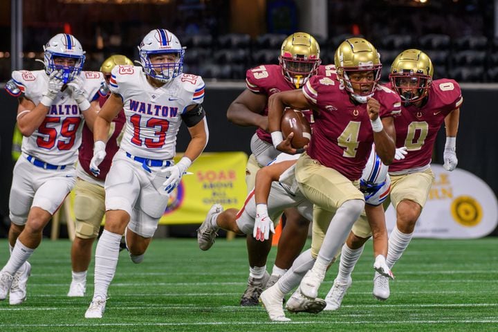 CJ Franklin, quarterback for Brookwood, runs the ball in the first quarter during the Corky Kell Classic. (Jamie Spaar for the Atlanta Journal Constitution)