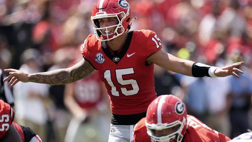 Georgia quarterback Carson Beck (15) directs his teammates during the first half of an NCAA college football game against Tennessee Tech Saturday, Sept. 7, 2024, in Athens, Ga. (AP Photo/John Bazemore)