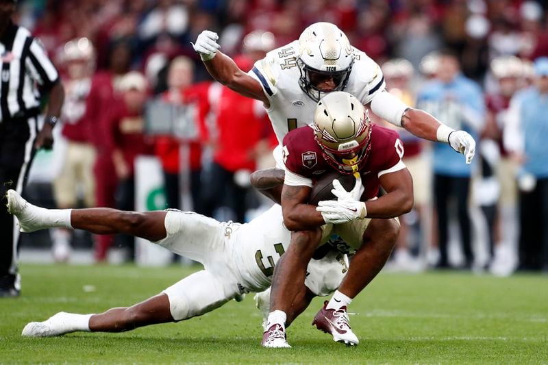 Florida's Ja'Khi Douglas is tackled during the NCAA college football game between Georgia Tech and Florida State at the Aviva stadium in Dublin, Saturday, Aug. 24, 2024. (AP Photo/Peter Morrison)