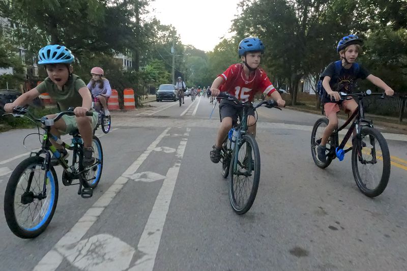 Participants in the weekly Parkside Elementary School “bike bus” head towards the school Friday, Sept. 20, 2024, in Atlanta. Ben Gray for the Atlanta Journal-Constitution