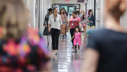Parents and students arrive for the first day of school at Harmony Elementary School in Buford on Wednesday, August 2, 2023. (Natrice Miller/ Natrice.miller@ajc.com)