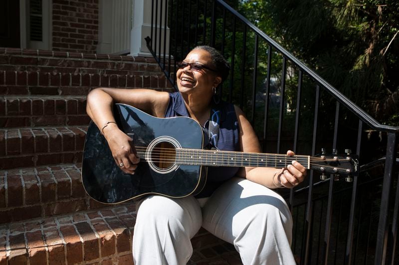 United Methodist Church Bishop Robin Dease poses for a portrait at her home in Atlanta on Friday, May 26, 2023. She is working toward her goal of learning to play the guitar. CHRISTINA MATACOTTA FOR THE ATLANTA JOURNAL-CONSTITUTION. 