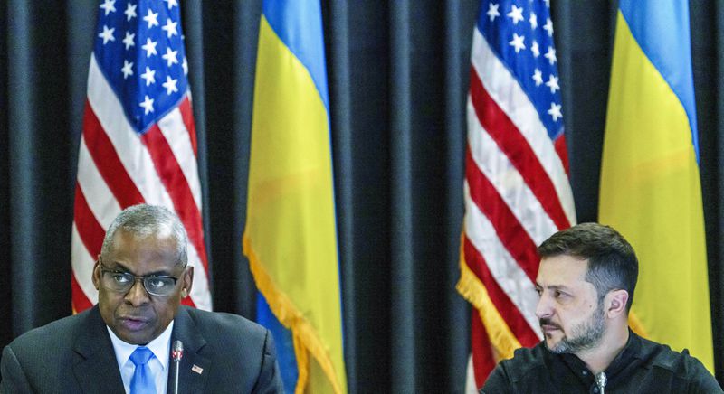 Defense Secretary Lloyd Austin, left and Ukrainian President Volodymyr Zelenskyy sit next to each other during the Ukraine Contact Group meeting at Ramstein Air Base, Friday, Sept.6, 2024. (Andreas Arnold/dpa via AP)