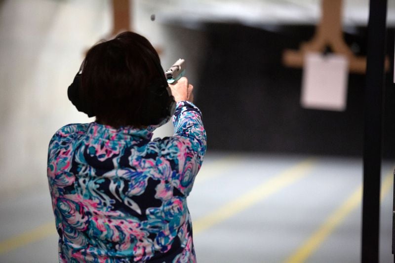 Suzanne Hawkins fires at a target during a Saturday morning handgun training class at Georgia Gun Club.  Gun dealers say women are a fast-growing segment of the gun-buying public. STEVE SCHAEFER FOR THE ATLANTA JOURNAL-CONSTITUTION