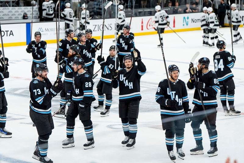 The Utah Hockey Club celebrates their win over the Los Angeles Kings in overtime in a preseason NHL hockey game, Monday, Sept. 23, 2024, in Salt Lake City. (AP Photo/Spenser Heaps)