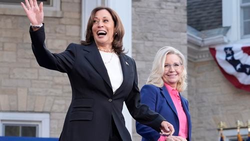 Democratic presidential nominee Vice President Kamala Harris, left, arrives to speak at a campaign event with former Congresswoman Liz Cheney, R-Wyo., right, at Ripon College in Ripon, Wis., Thursday, Oct. 3, 2024. (AP Photo/Mark Schiefelbein)