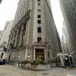 FILE - The entrance to the New York Stock Exchange at Wall and New Streets is shown on Oct. 2, 2024, in New York. (AP Photo/Peter Morgan, File)