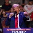 Republican presidential nominee former President Donald Trump makes a boxing gesture as he talks women's Olympic boxing during campaign rally at Ed Fry Arena in Indiana, Pa., Monday, Sept. 23, 2024. (AP Photo/Rebecca Droke)