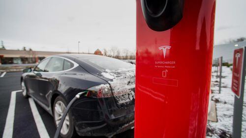 A Model S electric vehicle (EV) charges at a supercharger station at the Tesla Motors Inc. Gallery and Service Center in Paramus, New Jersey, U.S., on Thursday, Dec. 11, 2014. Tesla rose 1.2 percent at the end of trading mid last week to close at $216.89 after falling as low as $204.27. For the year, the shares have gained 44 percent. Photographer: Ron Antonelli/Bloomberg A Model S electric vehicle (EV) charges at a supercharger station at the Tesla Motors Inc. Gallery and Service Center in Paramus, New Jersey. Ron Antonelli/Bloomberg