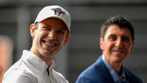 NASCAR driver Daniel Suarez, of Mexico, smiles alongside NASCAR Mexico Series CEO and President Jimmy Morales, during a press conference in Mexico City, Tuesday, Aug. 27, 2024. (AP Photo/Eduardo Verdugo)