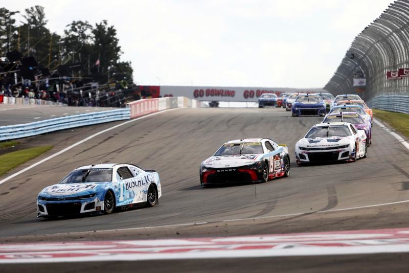 Ross Chastain (#1) drives into turn one during a NASCAR Cup Series auto race, Sunday, Sept. 15, 2024, in Watkins Glen, N.Y. (AP Photo/Lauren Petracca)