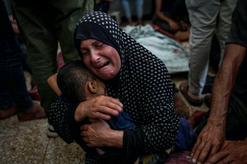 A Palestinian woman mourns a relatives killed in the Israeli bombardment of the Gaza Strip at a hospital morgue in Deir al-Balah, Wednesday, Aug. 28, 2024. (AP Photo/Abdel Kareem Hana)