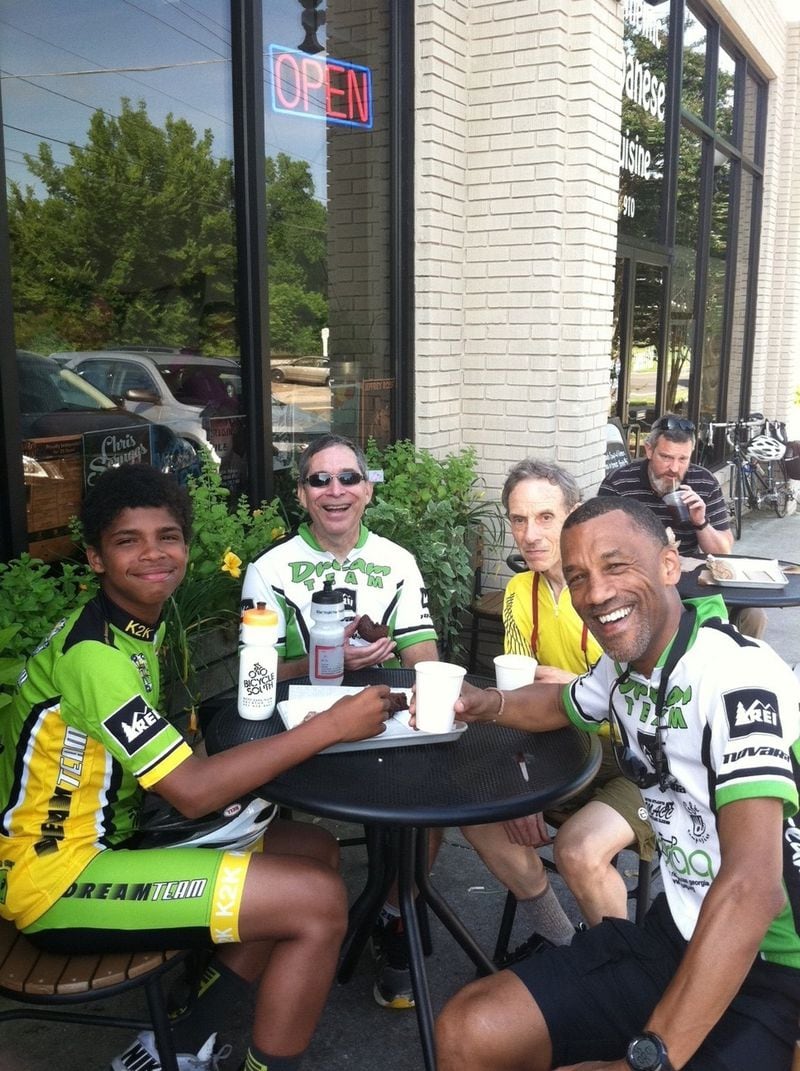 Atiba Mbiwa stops for a treat at Revolution Doughnuts with Dream Team coaches and riders during a training ride. Mbiwa, a New York native, has guided the Dream Team program, bringing young people into bicycling, for 25 years. CONTRIBUTED: DREAM TEAM