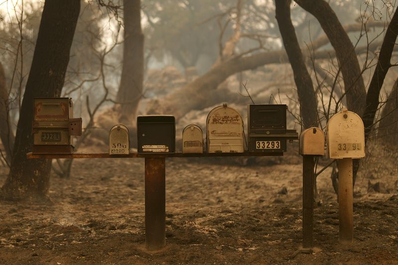 Mailboxes are still standing after the Airport Fire swept through Tuesday, Sept. 10, 2024, in El Cariso, an unincorporated community in Riverside County, Calif. (AP Photo/Eric Thayer)