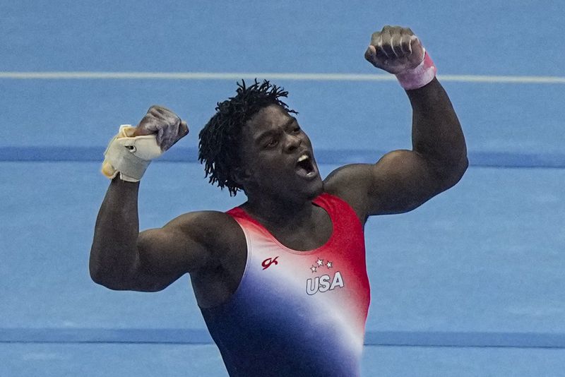 Frederick Richard celebrates after competing on the floor at the United States Gymnastics Olympic Trials on Thursday, June 27, 2024, in Minneapolis. (AP Photo/Charlie Riedel)