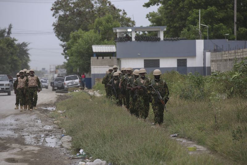 Kenyan police officers patrol an area near the international airport in Port-au-Prince, Haiti, Wednesday, July 3, 2024. (AP Photo/Odelyn Joseph)