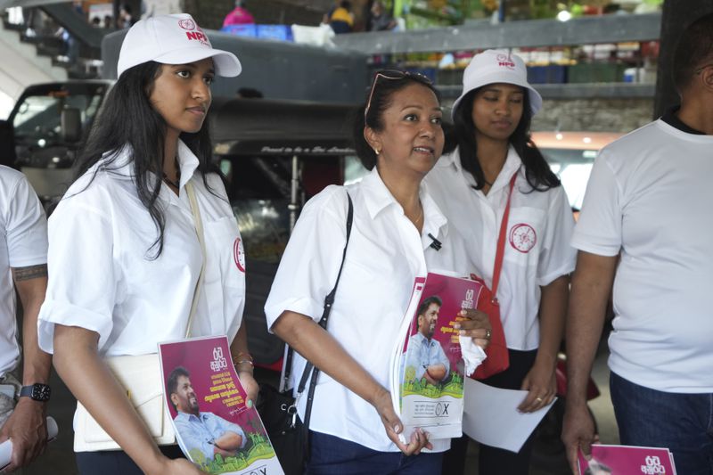 Sri Lankan women, who live outside of Sri Lanka, campaign for the National People's Power presidential candidate Anura Dissanayaka, in Colombo, Sri Lanka, Wednesday, Sept. 18, 2024. (AP Photo/Rajesh Kumar Singh)