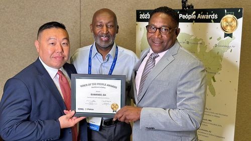 Suwanee Police Captain Dwayne Black and Lt. Simon Byun receive the Voice of the People Award. (Courtesy City of Suwanee)