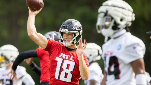 Falcons quarterback Kirk Cousins (18) practices during training camp at the Falcons’ headquarters in Flowery Branch on Friday, July 26, 2024. (Arvin Temkar / AJC)