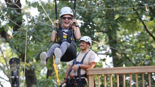 Kiley Griggs ziplines at Camp Twin Lakes in Rutledge during this summer’s Wheelchairs 4 Kids Camp. (Photo Courtesy of J DAVID)